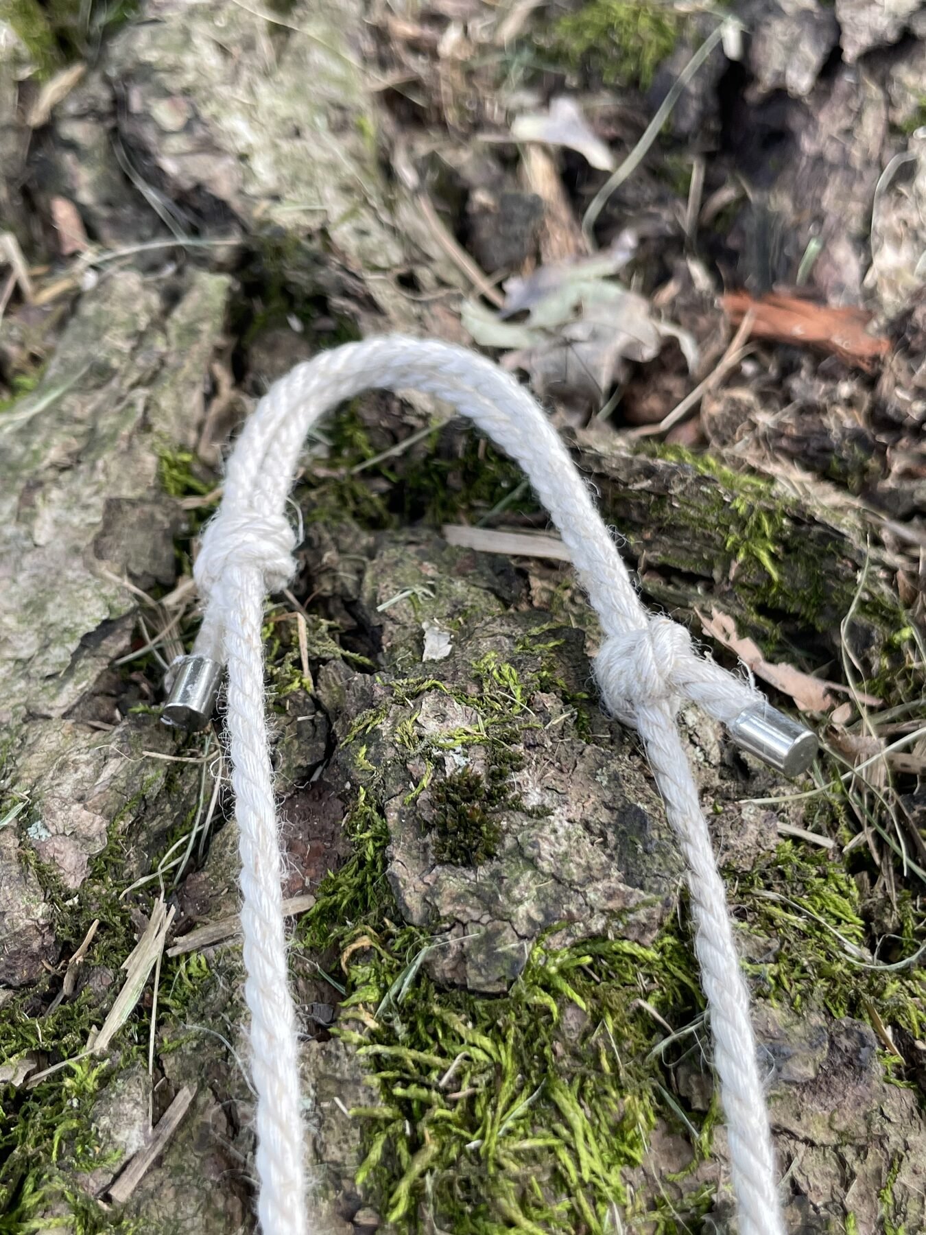 Adjustable white linen cord with metal end caps