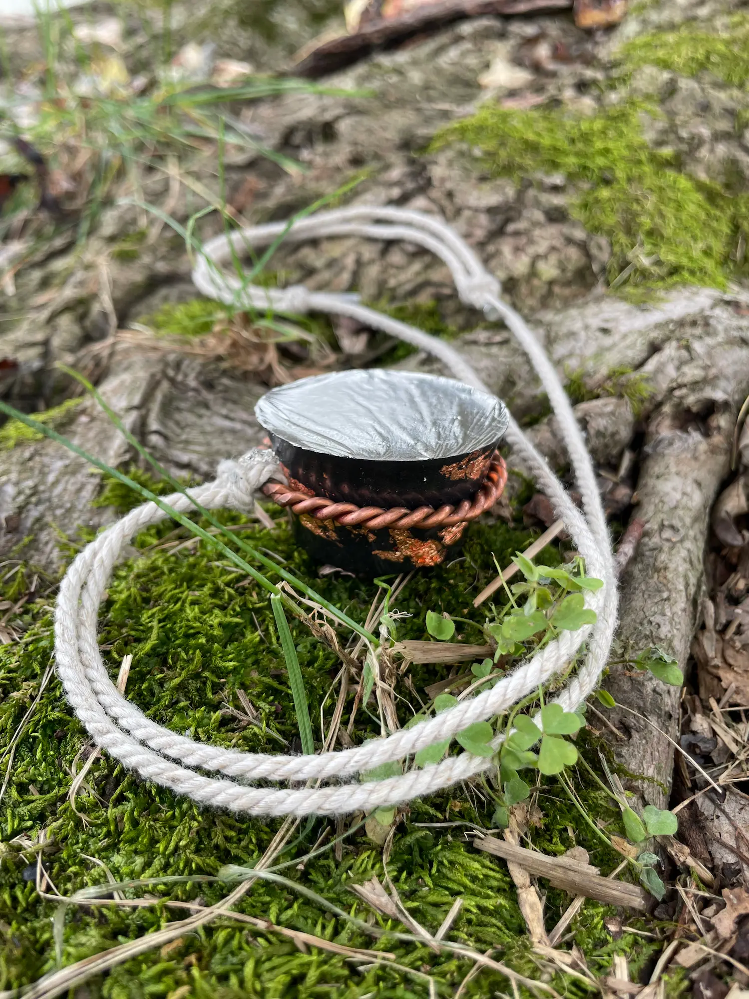Halo Hanger necklace fitted around one Peace Puck