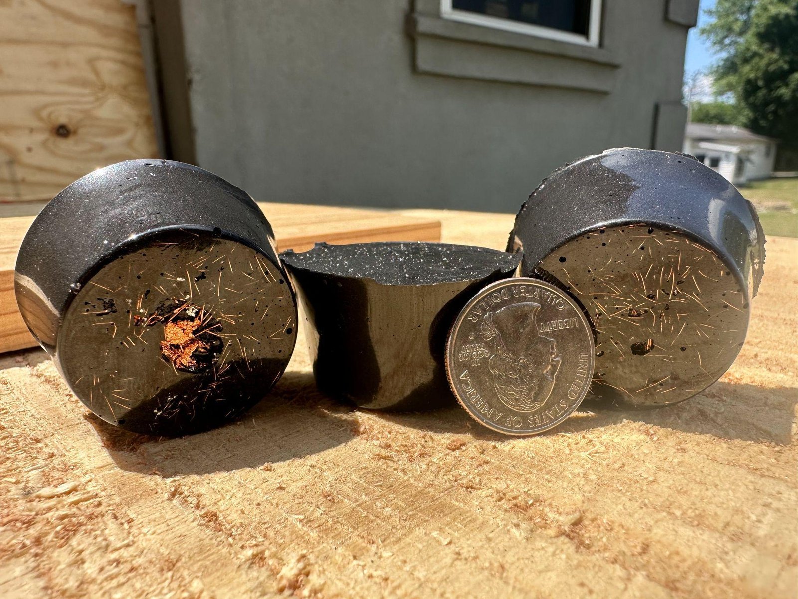 Three authentic hand-cast Peace Pucks with visible material inclusions